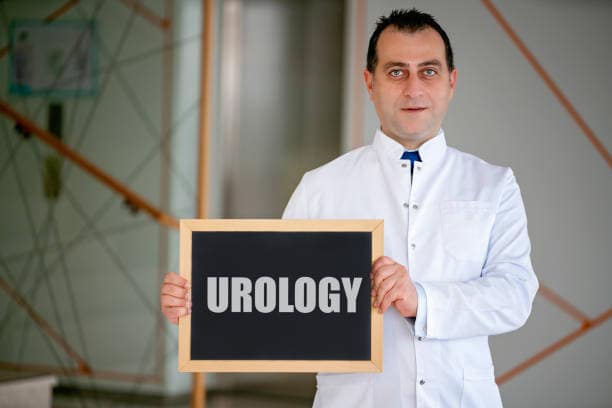 Doctor holding a blackboard written Urology, Medical concept